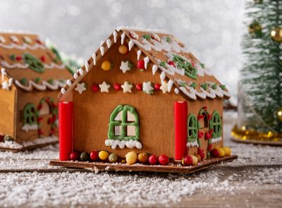 Christmas gingerbread house on white glitter background